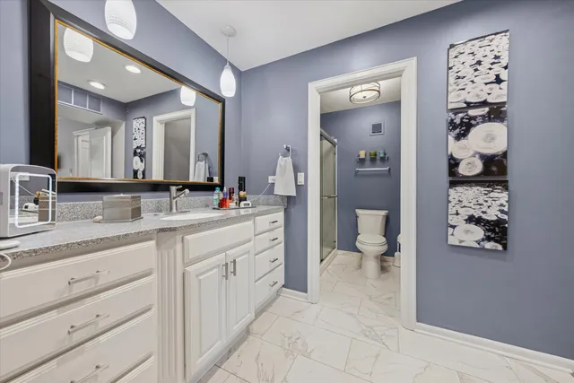 a bathroom with a sink vanity and a mirror