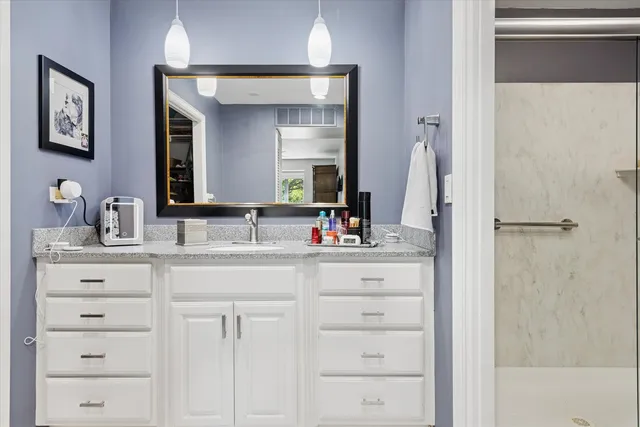 a bedroom with furniture and a ceiling fan
