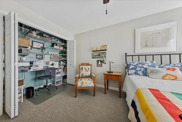 a bathroom with a sink a toilet and a large mirror