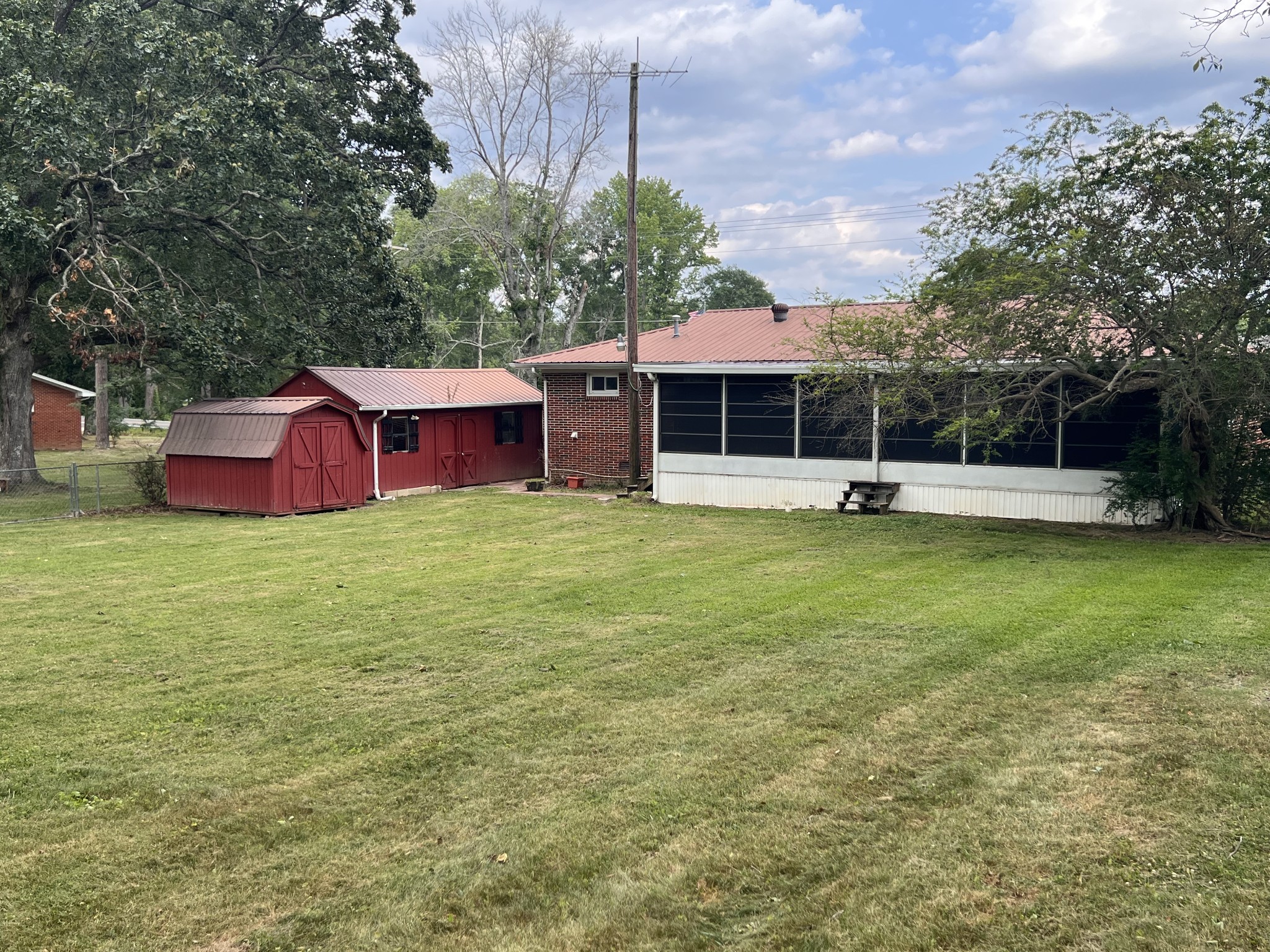 111 Shelton Road Manchester, TN 37355 - Photo 3 of 37 a view of a house with a yard and sitting area