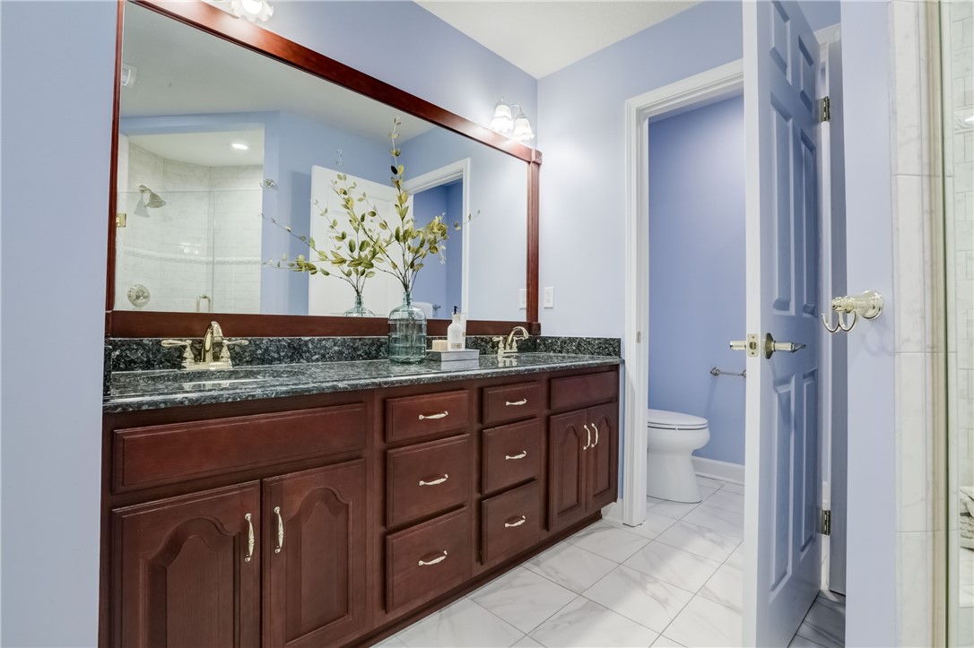 3243 Abbey Road Buffalo, NY 14224 - Photo 21 of 36 Two person vanity with attractive dark granite cou