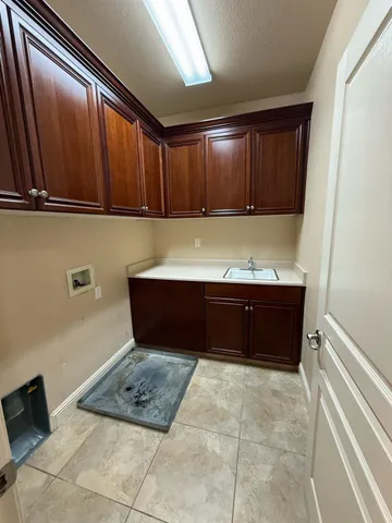 a view of kitchen with cabinets