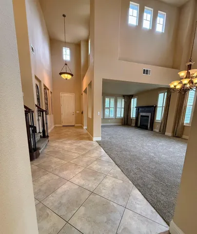 a view of a hallway with windows