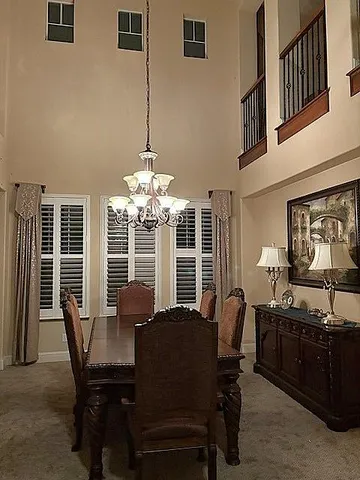 a dining room with furniture and window