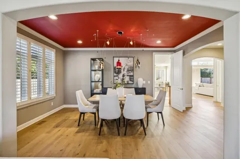 a view of a dining room with furniture window and wooden floor