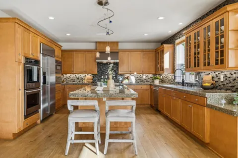 a dining room with furniture and windows