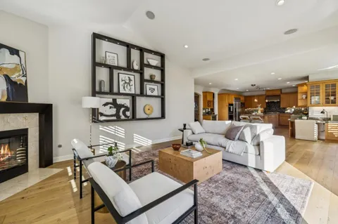 a view of a hallway and dining room with livingroom view