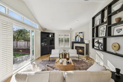 a bed room with a bed and a chair