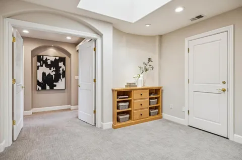a bathroom with a double vanity sink mirror and shower