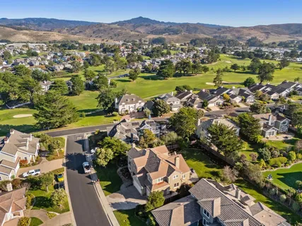 an aerial view of a house with a lake view