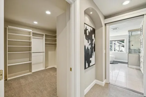 a bathroom with a sink a mirror and a shower
