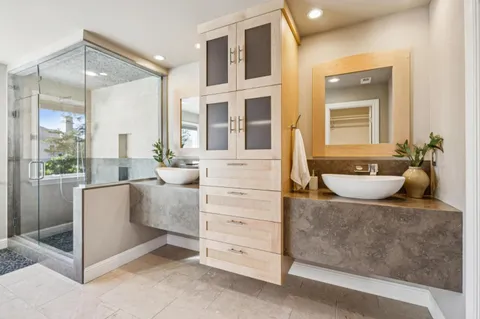 a front view of a house with swimming pool and chairs