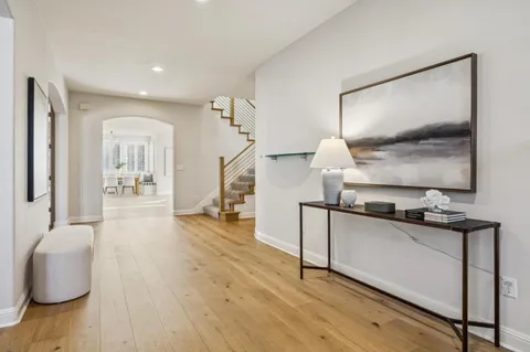 a living room with furniture wooden floor and a fireplace