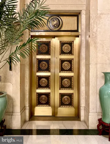 a view of front door with a door and a window