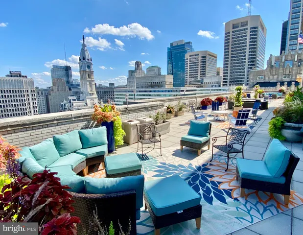 a view of city from balcony with seating space