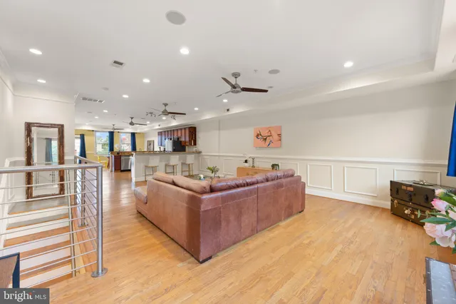 a large kitchen with a table and chairs