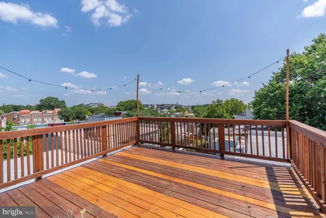 a view of balcony with wooden floor