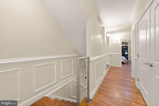 a view of balcony with wooden floor and fence