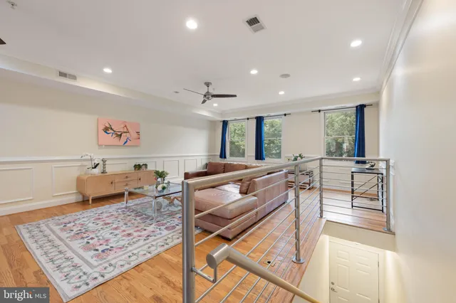 a living room with furniture and a rug