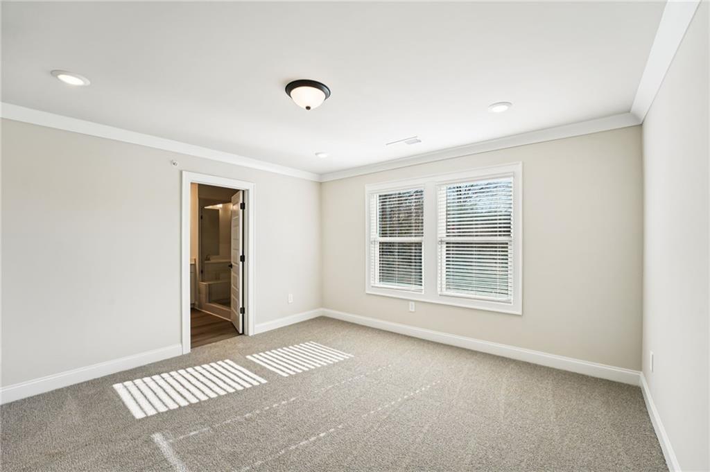 6450 Pinin Place Cumming, GA 30041 - Photo 43 of 53 an empty room with windows