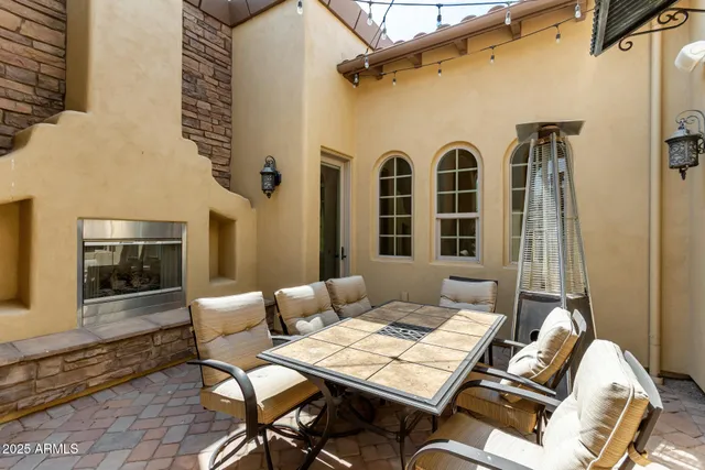 a view of a patio with couple of chairs