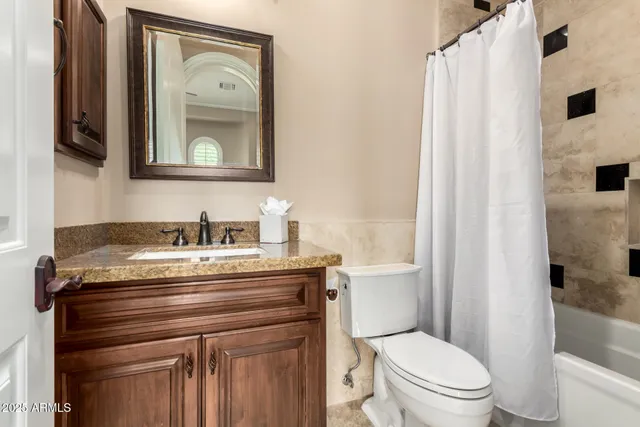 a bathroom with sink and bathtub with toilet