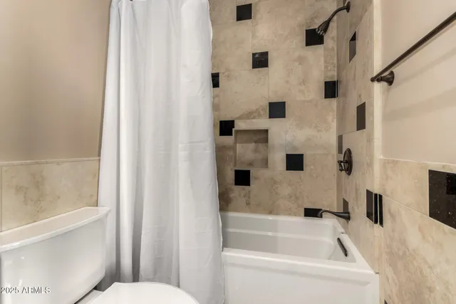 a kitchen with granite countertop a sink stove and cabinets