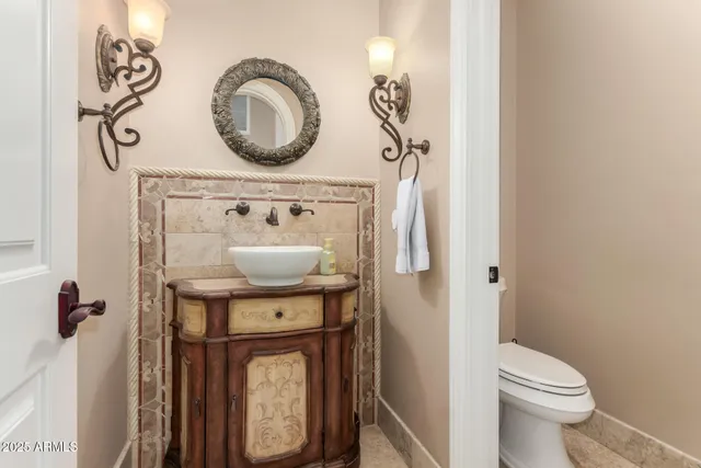 a kitchen with a sink a stove and cabinets