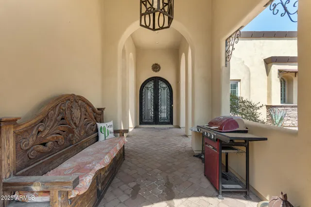 a bedroom with a bed and a mirror