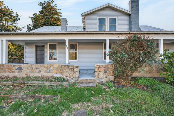 front view of a house with a yard