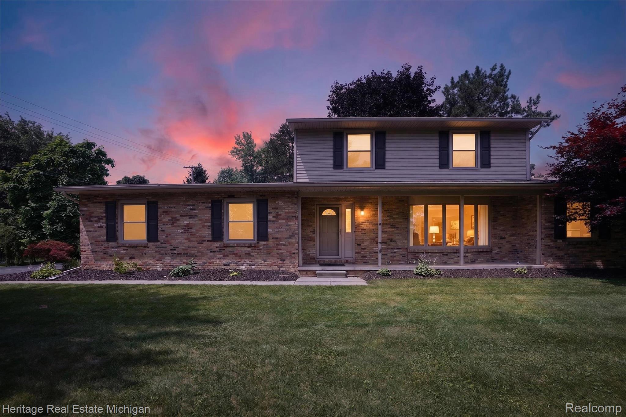 14038 North Hogan Road Linden, MI 48451 - Photo 1 of 53 Two-story residence featuring a brick facade with horizontal siding on the upper level