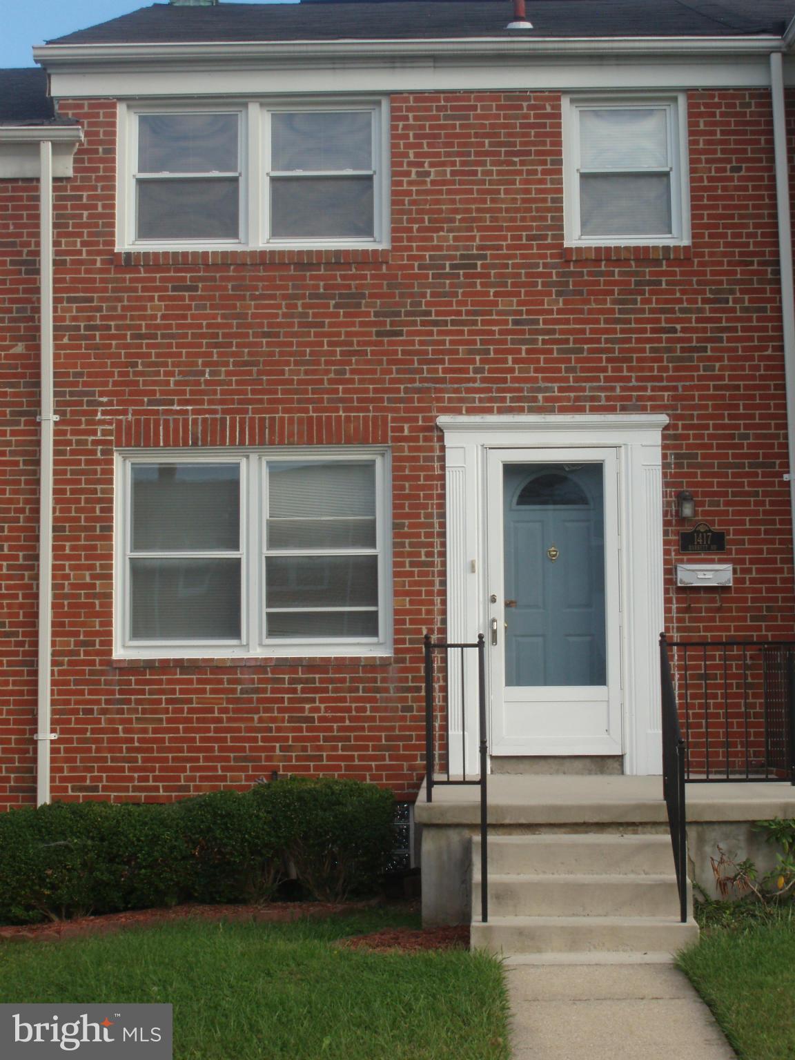 1417 Barrett Road Baltimore, MD 21207 - Photo 1 of 18 a view of a brick house with many windows