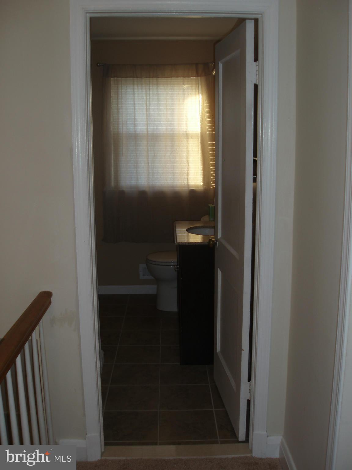 1417 Barrett Road Baltimore, MD 21207 - Photo 11 of 18 a bathroom with a mirror