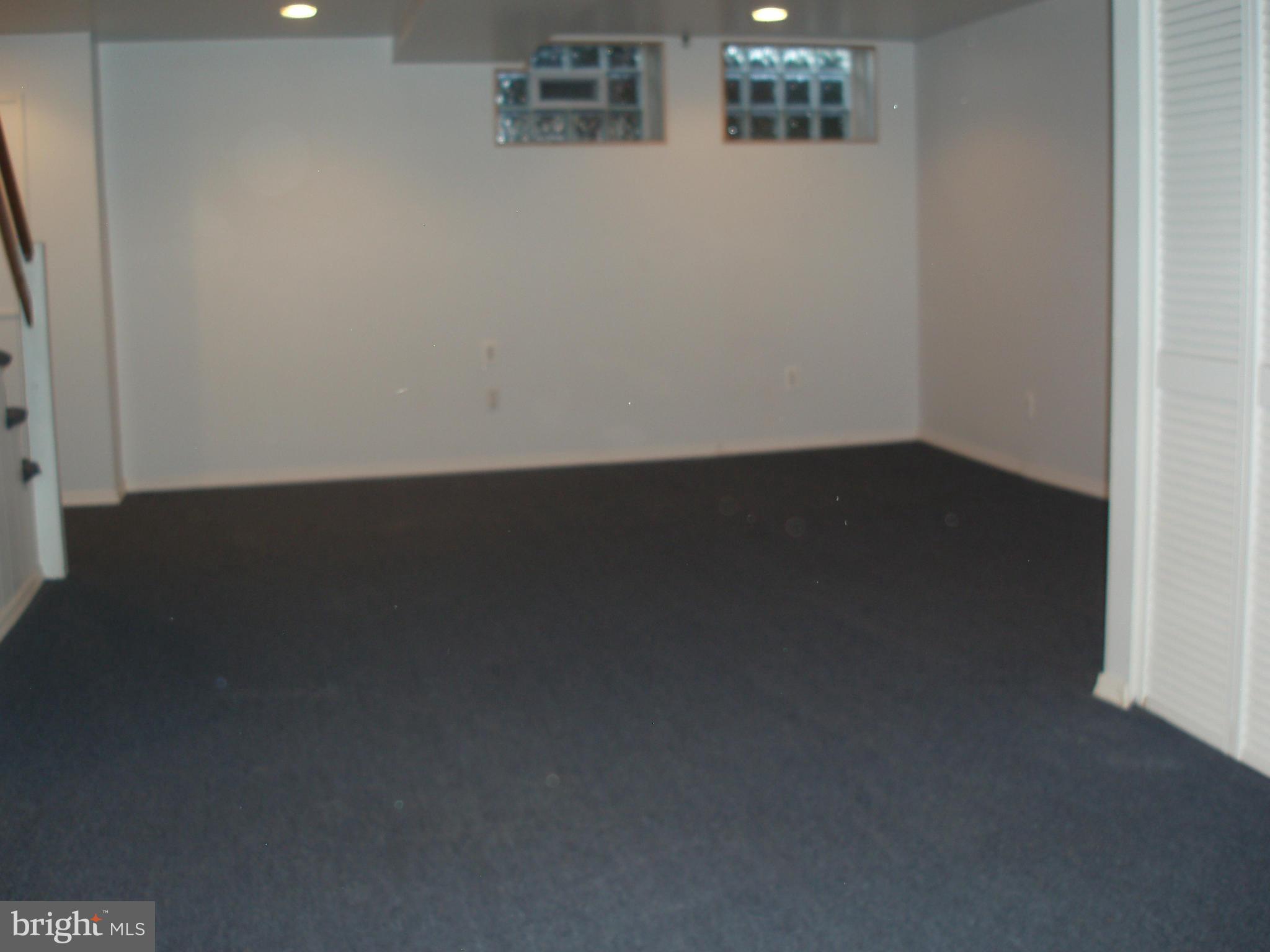 1417 Barrett Road Baltimore, MD 21207 - Photo 15 of 18 a view of a closet area with wooden floor