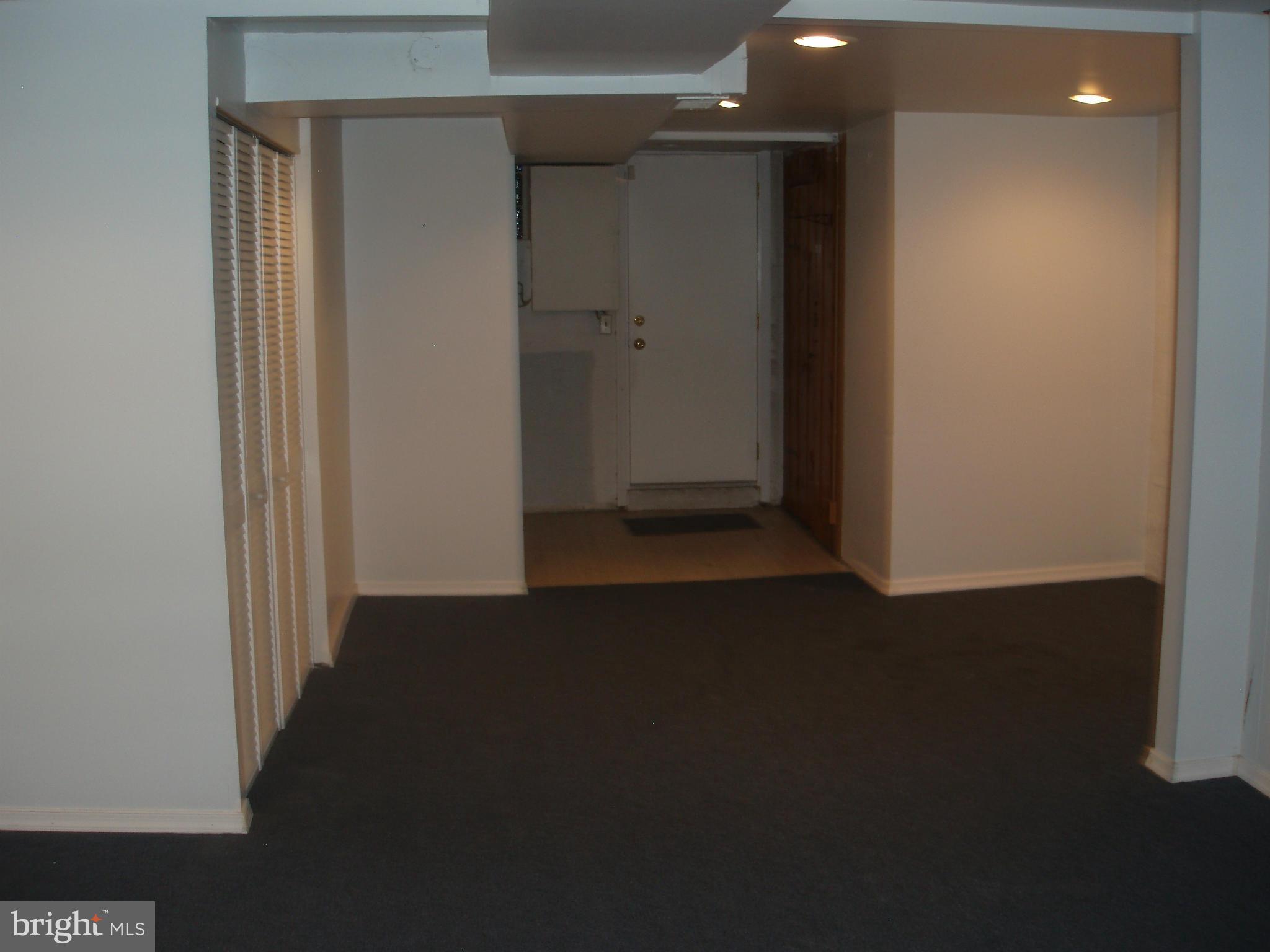 1417 Barrett Road Baltimore, MD 21207 - Photo 16 of 18 a view of a hallway with wooden floor