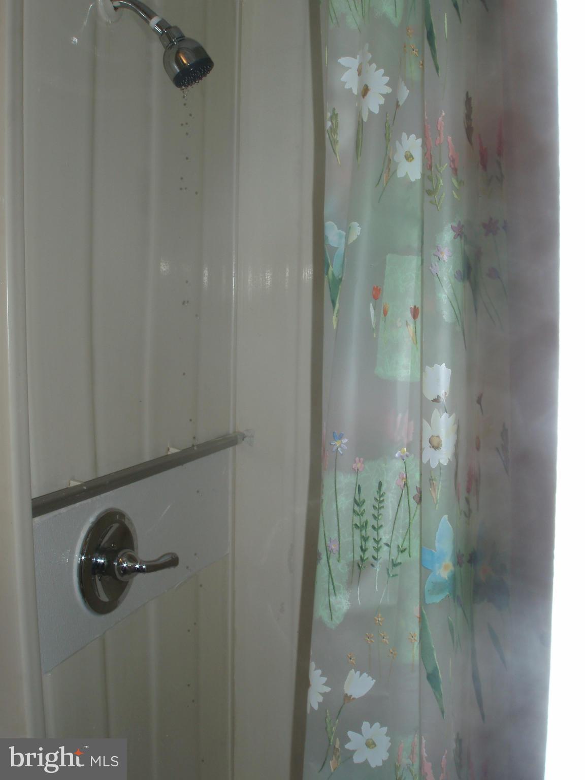 1417 Barrett Road Baltimore, MD 21207 - Photo 17 of 18 a bathroom with a glass shower door