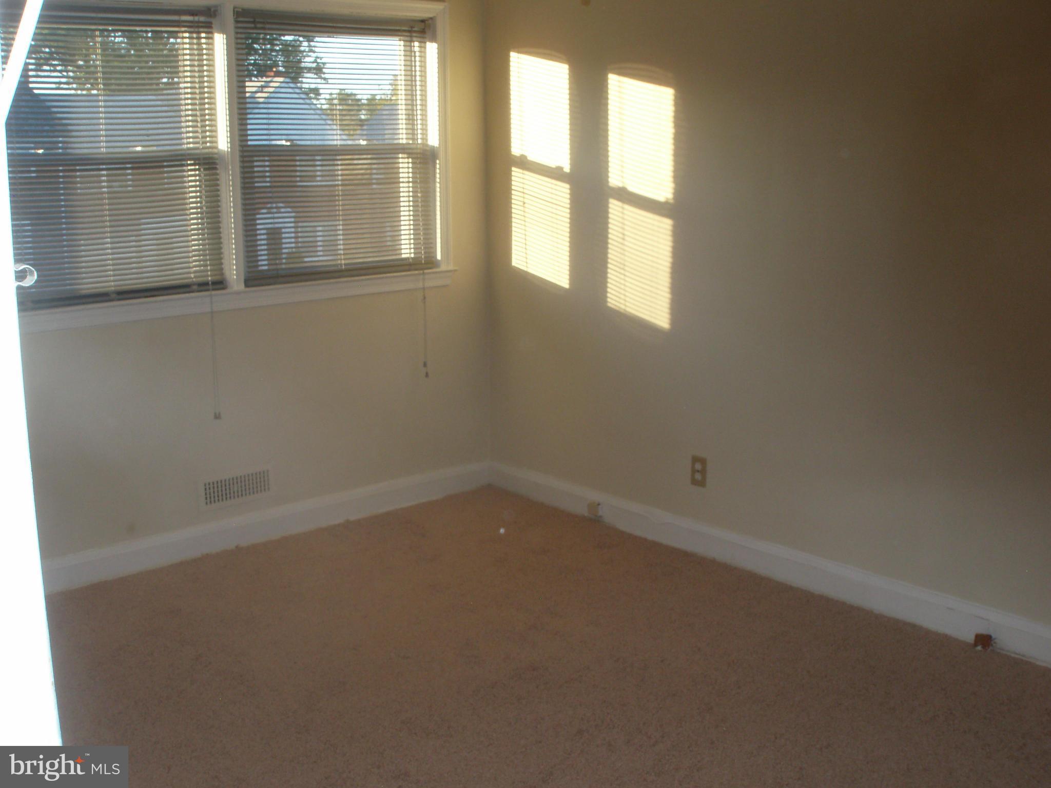 1417 Barrett Road Baltimore, MD 21207 - Photo 7 of 18 an empty room with a window