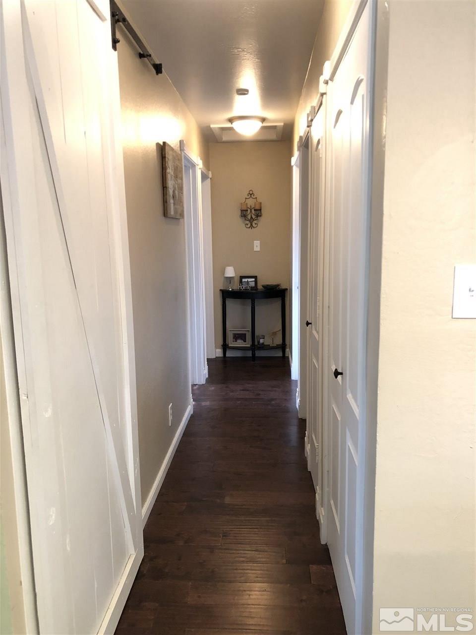 1785 Ada's Street Reno, NV 89509 - Photo 7 of 19 a view of a hallway with wooden floor