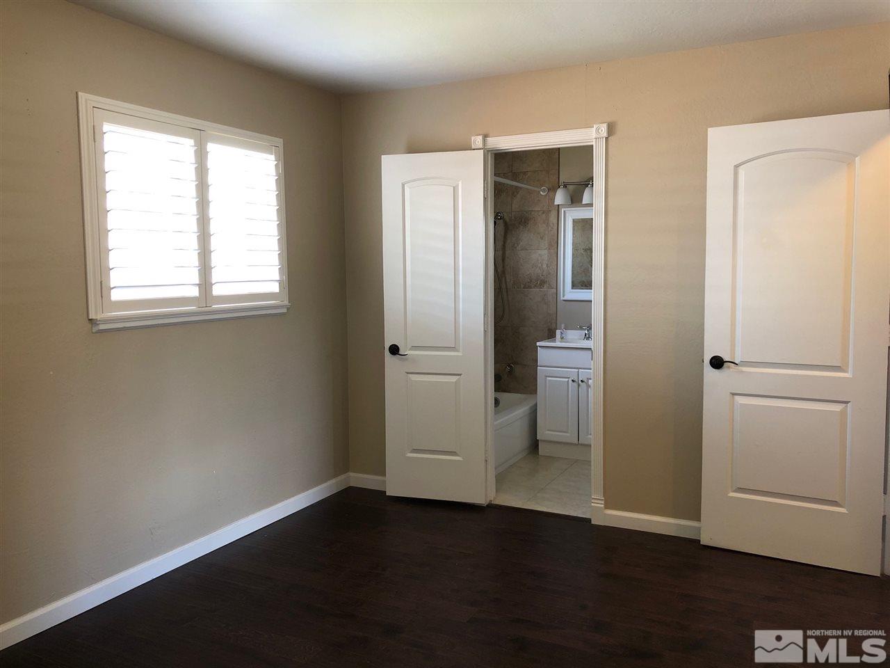 1785 Ada's Street Reno, NV 89509 - Photo 9 of 19 an empty room with wooden floor closet and windows