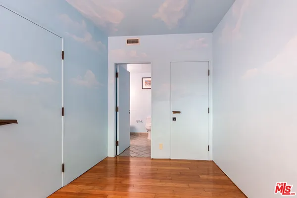 a bathroom with a sink mirror and toilet