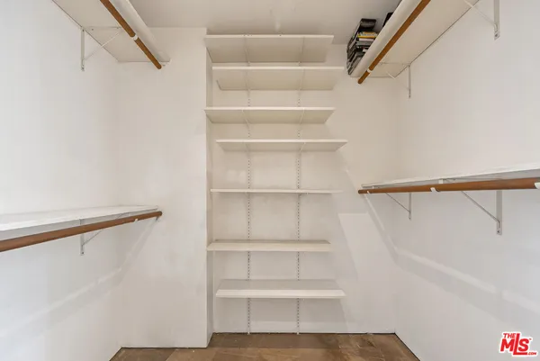 a bathroom with a granite countertop tub a sink and a mirror