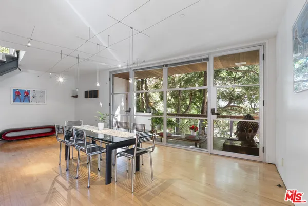 a front view of a house with outdoor seating