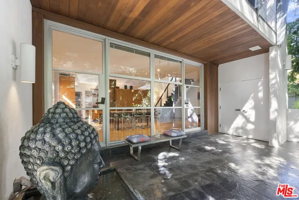 a view of entryway with wooden floor and stairs