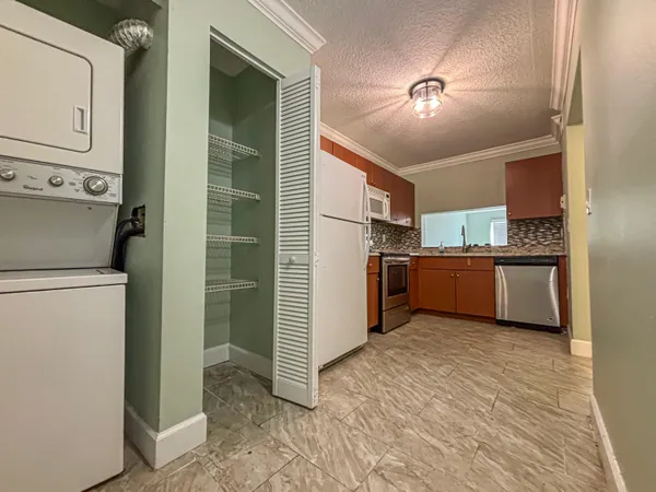 a view of a kitchen with a sink cabinets and window