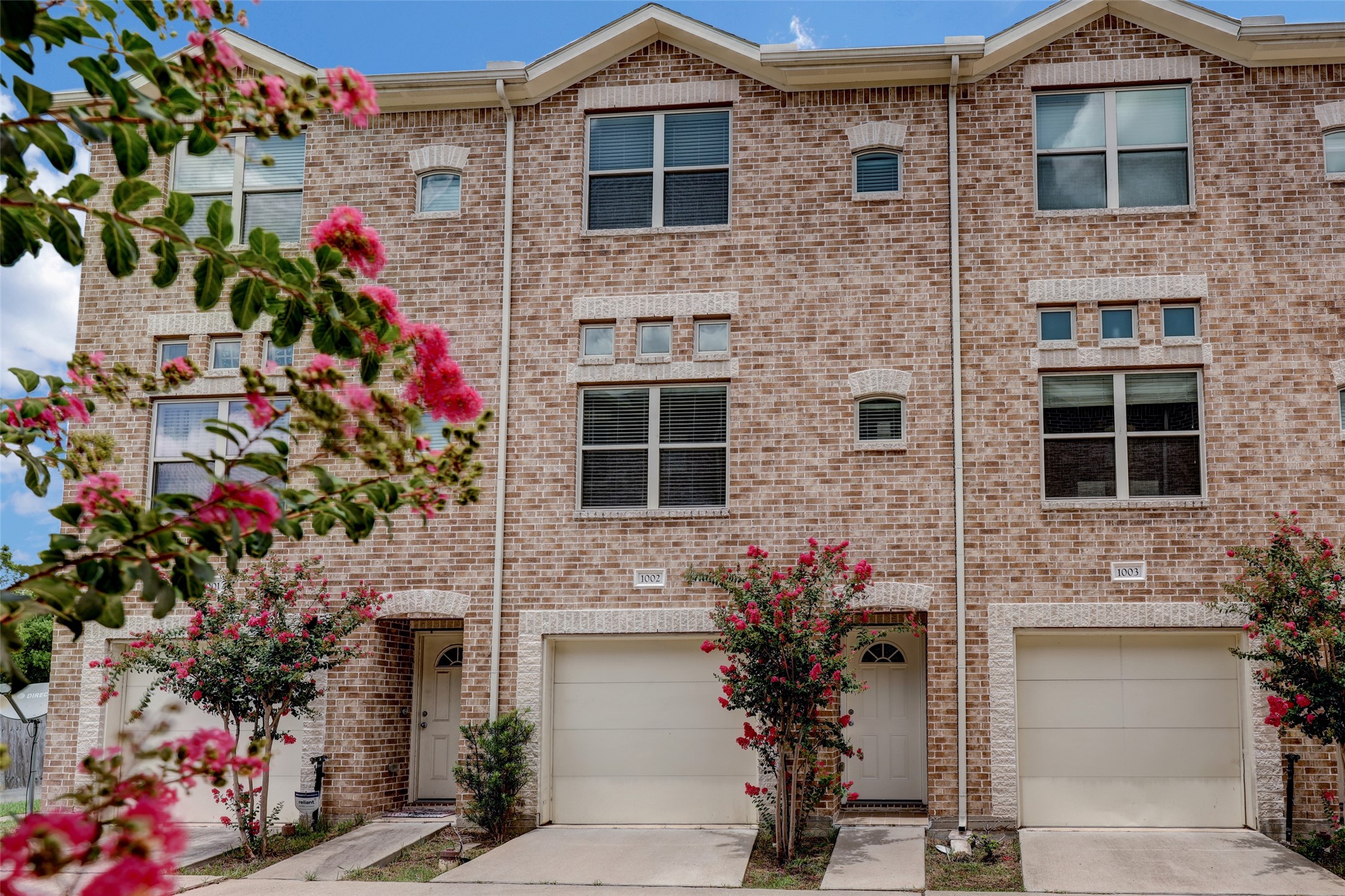 5941 South Loop E Freeway, Unit 1002 Houston, TX 77033 - Photo 1 of 16 a flower garden in front of flowers