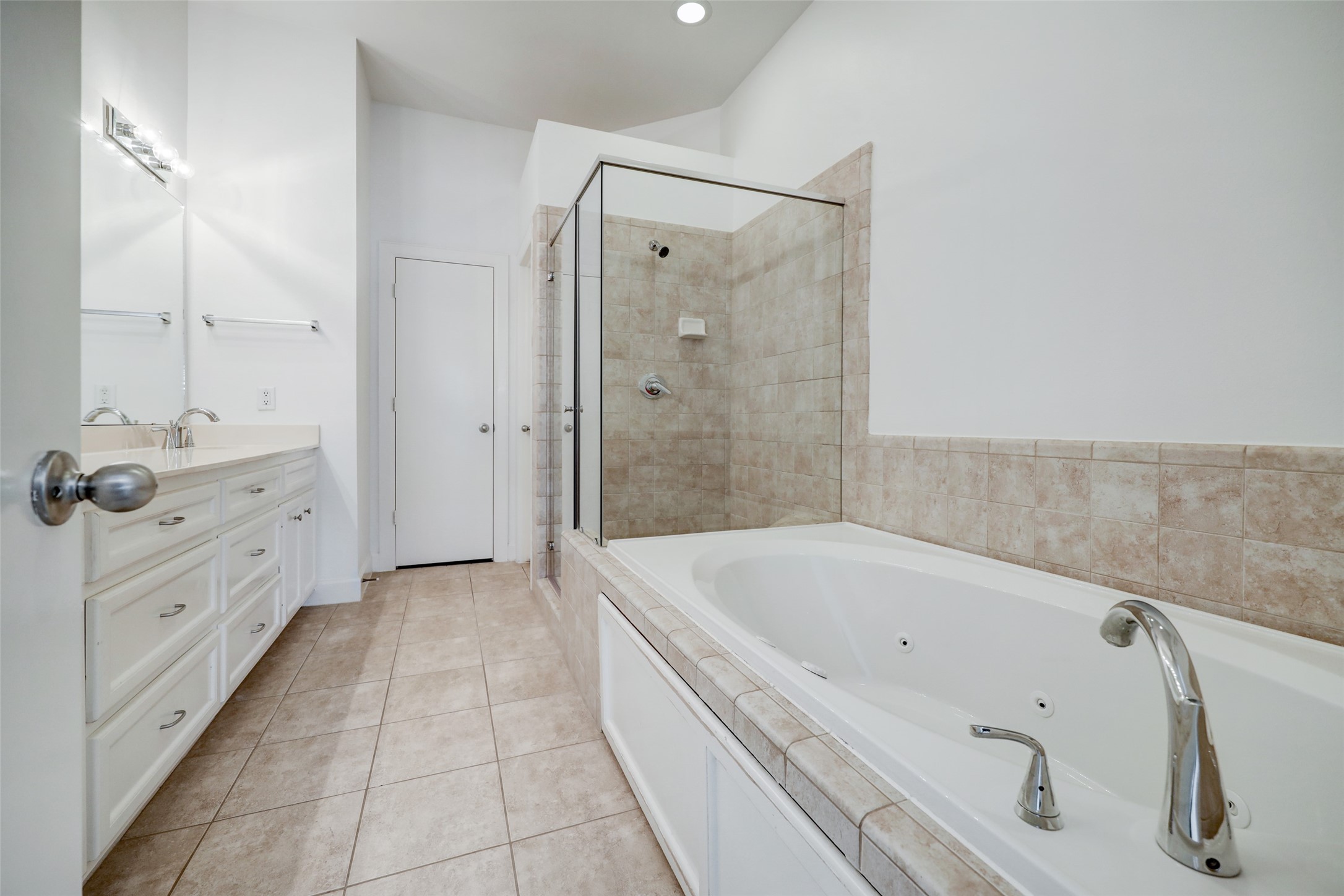 5941 South Loop E Freeway, Unit 1002 Houston, TX 77033 - Photo 13 of 16 a bathroom with a tub a sink and a shower