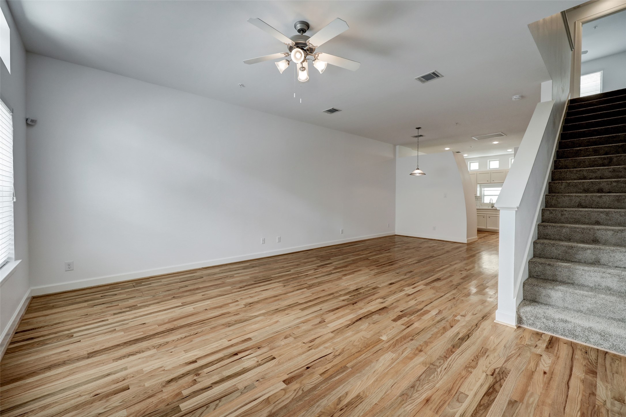 5941 South Loop E Freeway, Unit 1002 Houston, TX 77033 - Photo 2 of 16 wooden floor in an empty room with a window