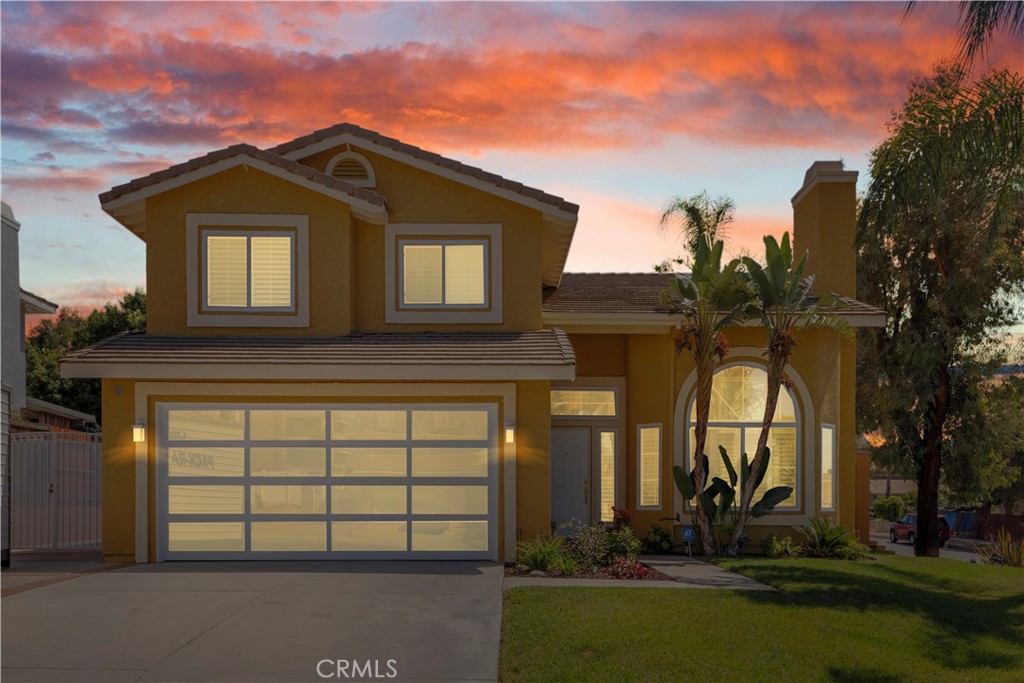 front view of a house with a yard