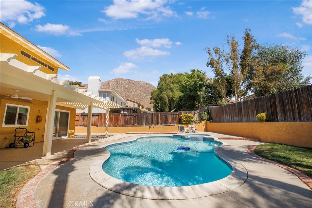 22705 Robin Way Grand Terrace, CA 92313 - Photo 11 of 15 a view of a swimming pool with a patio