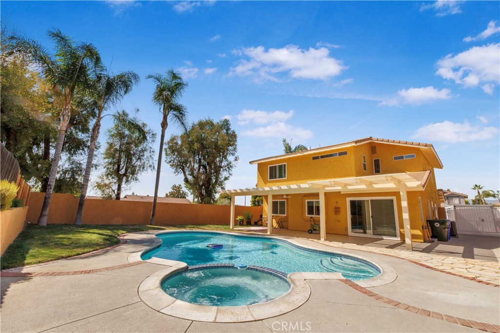 22705 Robin Way Grand Terrace, CA 92313 - Photo 12 of 15 front view of a house with a yard